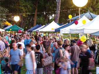 A crowd of people enjoying a local fair.